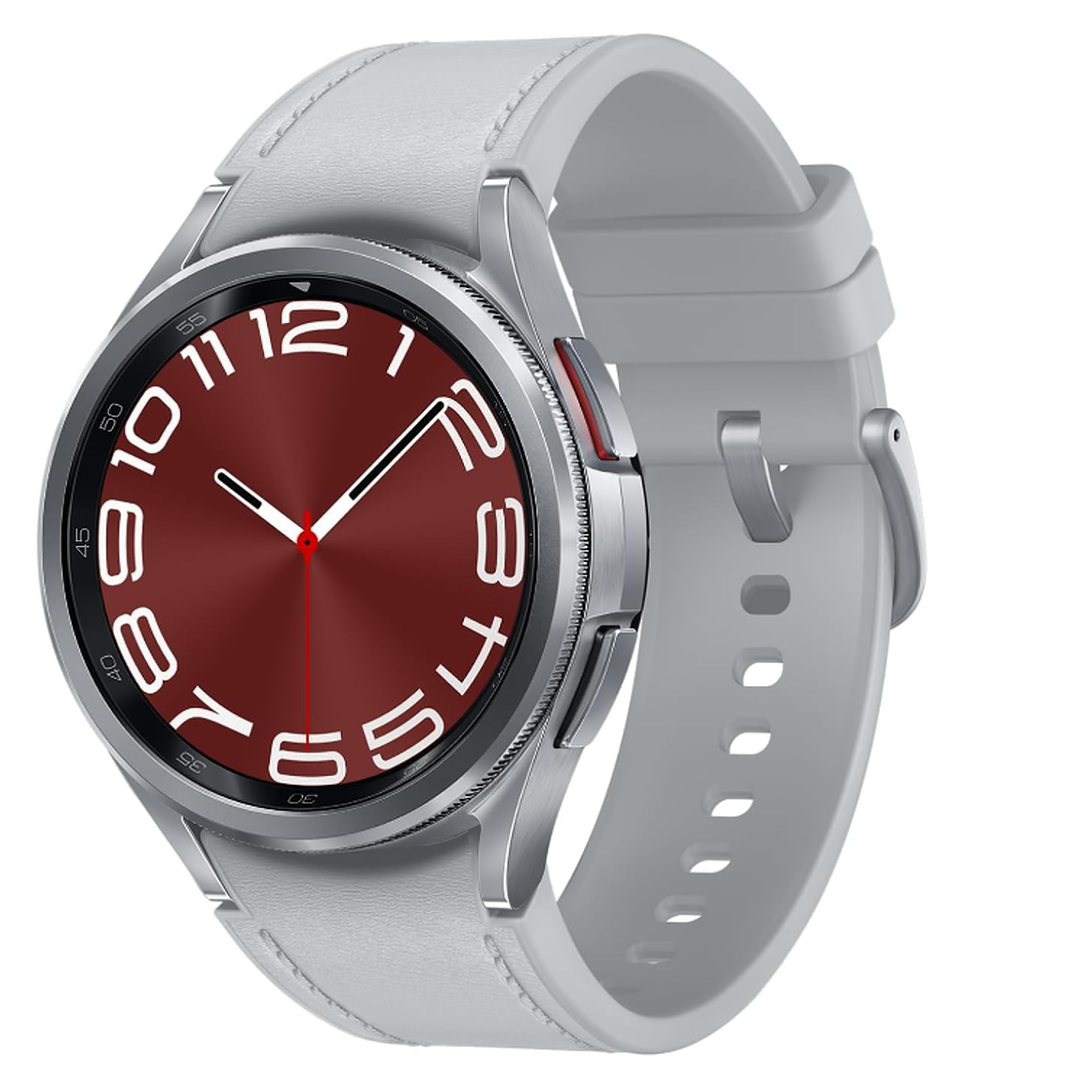 A smartwatch with a round silver-tone case, a deep red analog-style face with white numerals and hands, and a light gray silicone strap, shown on a plain white background.